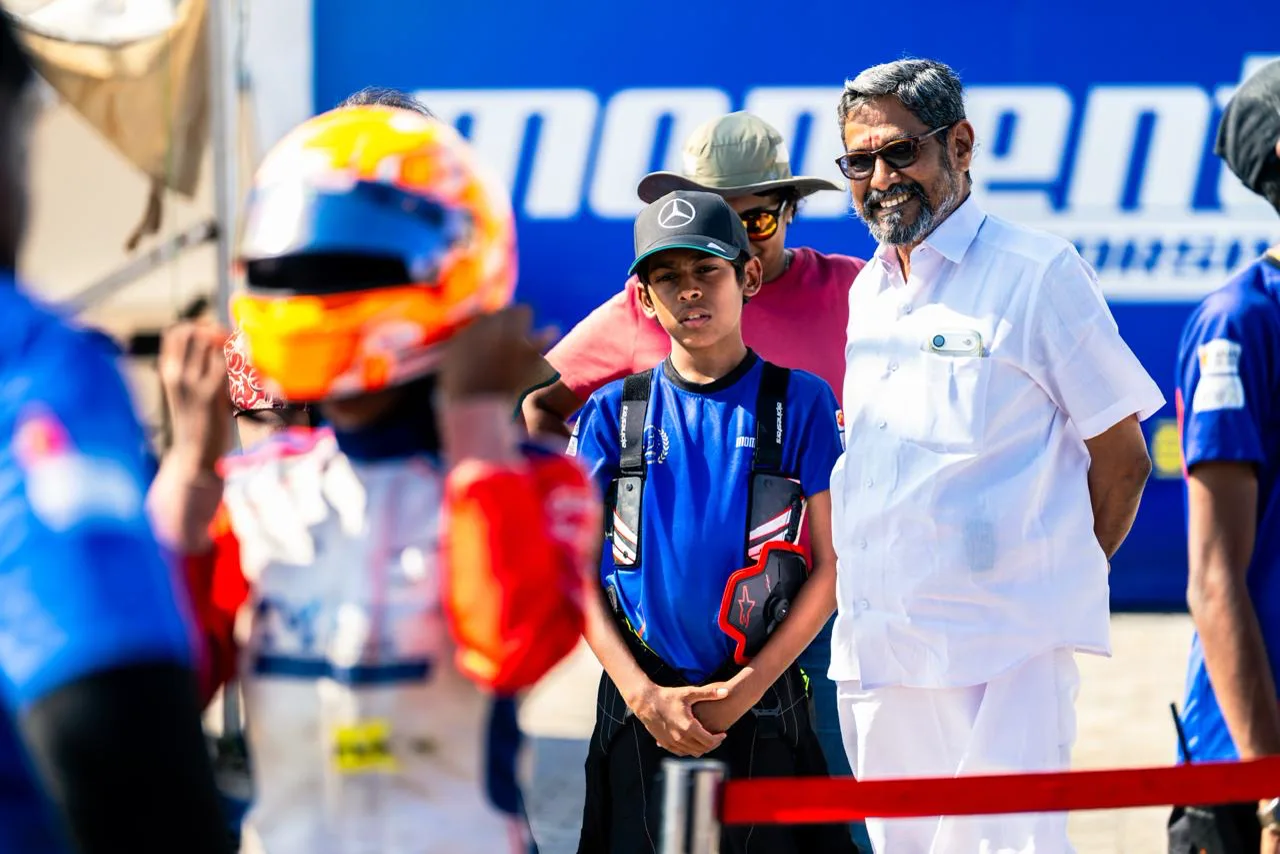 Vidyuth in Momentum Motorsports colours in the paddock