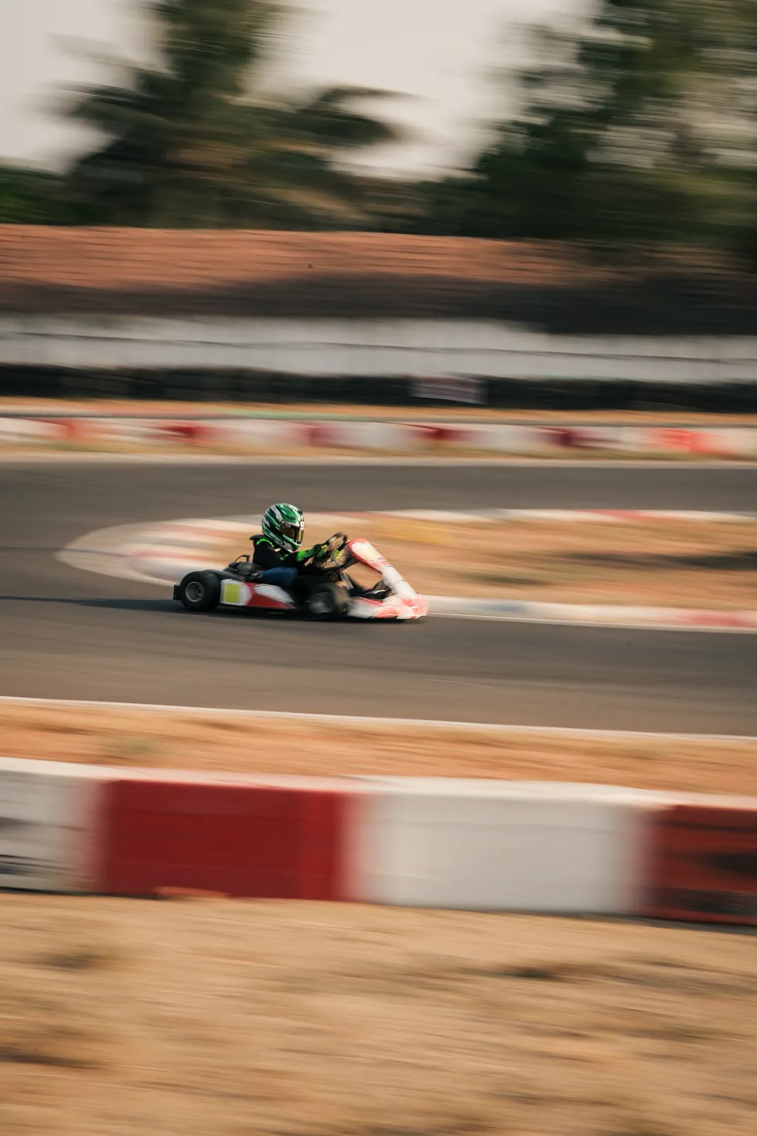 Panning shot of Vidyuth cornering at full speed