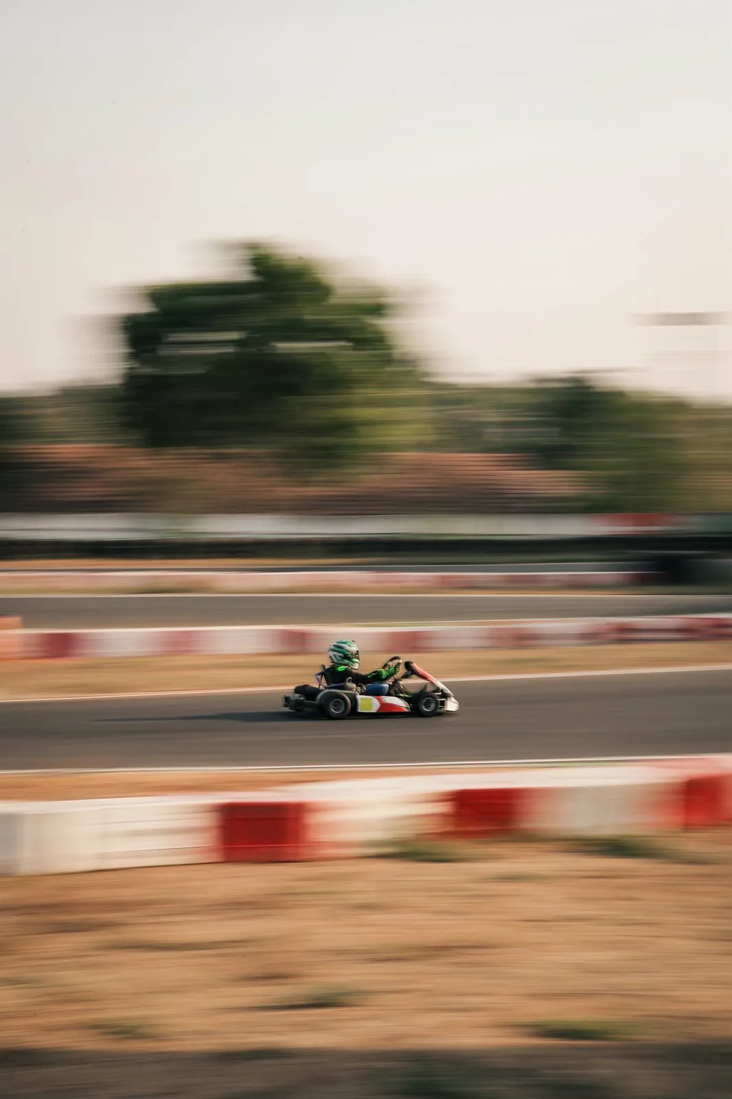 Vidyuth flat out on the straight, the kerbs a blur
